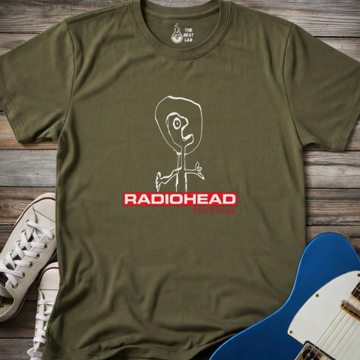 Military green gildan 64000 adult unisex shirt featuring Radiohead The Bends studio album