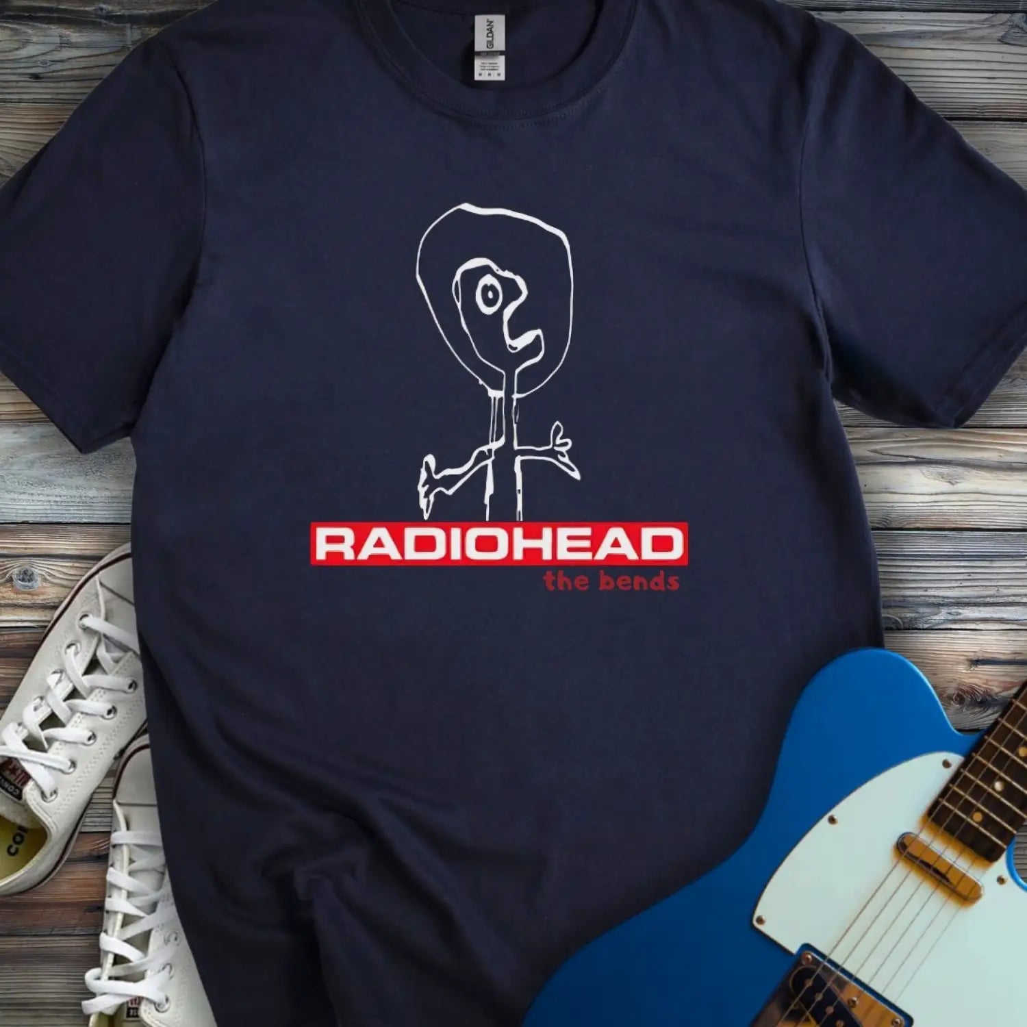 Navy blue color of Radiohead The Bends album graphic t-shirt featuring minimalist stick figure design, perfect for alternative rock fans