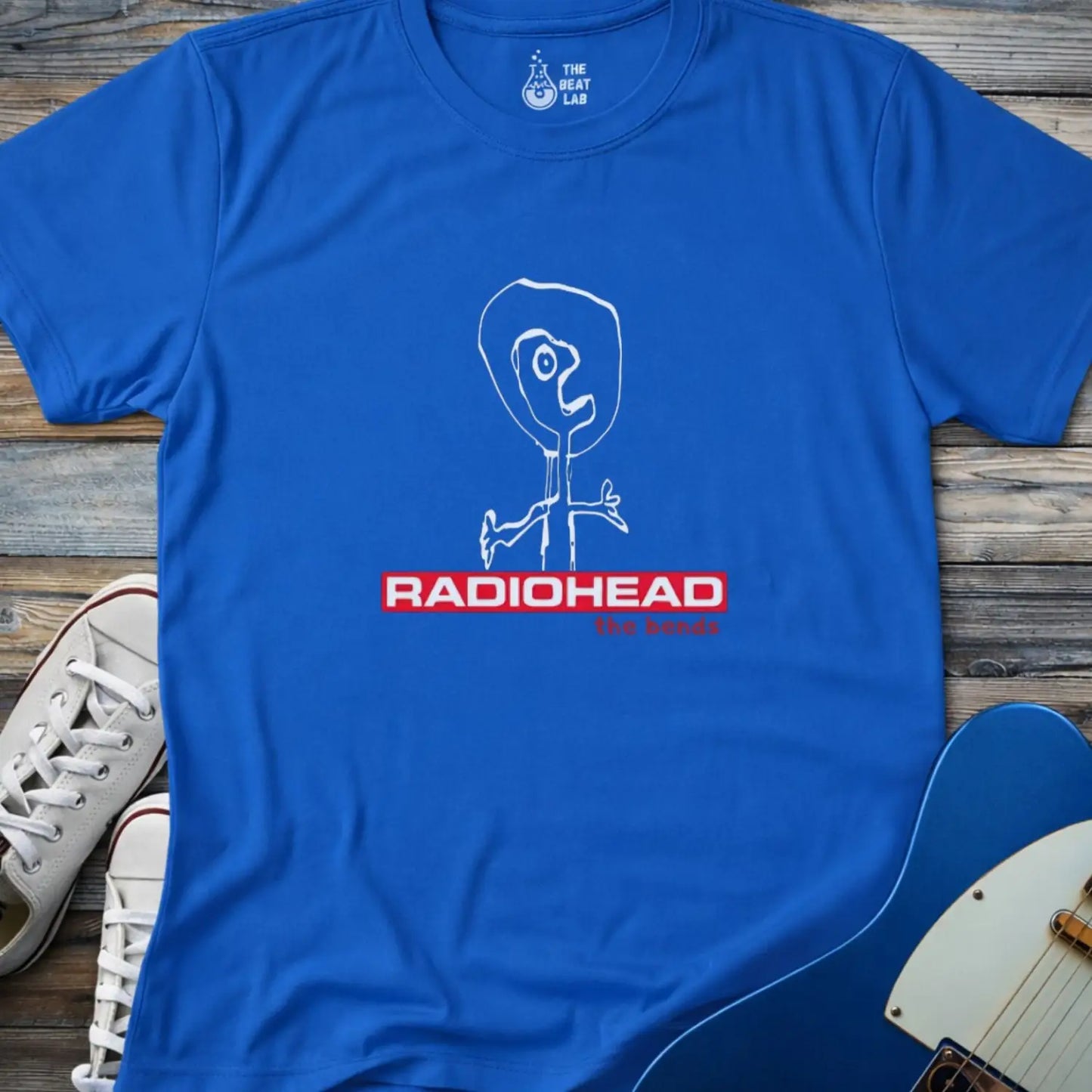 Royal blue gildan 64000 adult unisex shirt featuring Radiohead The Bends studio album