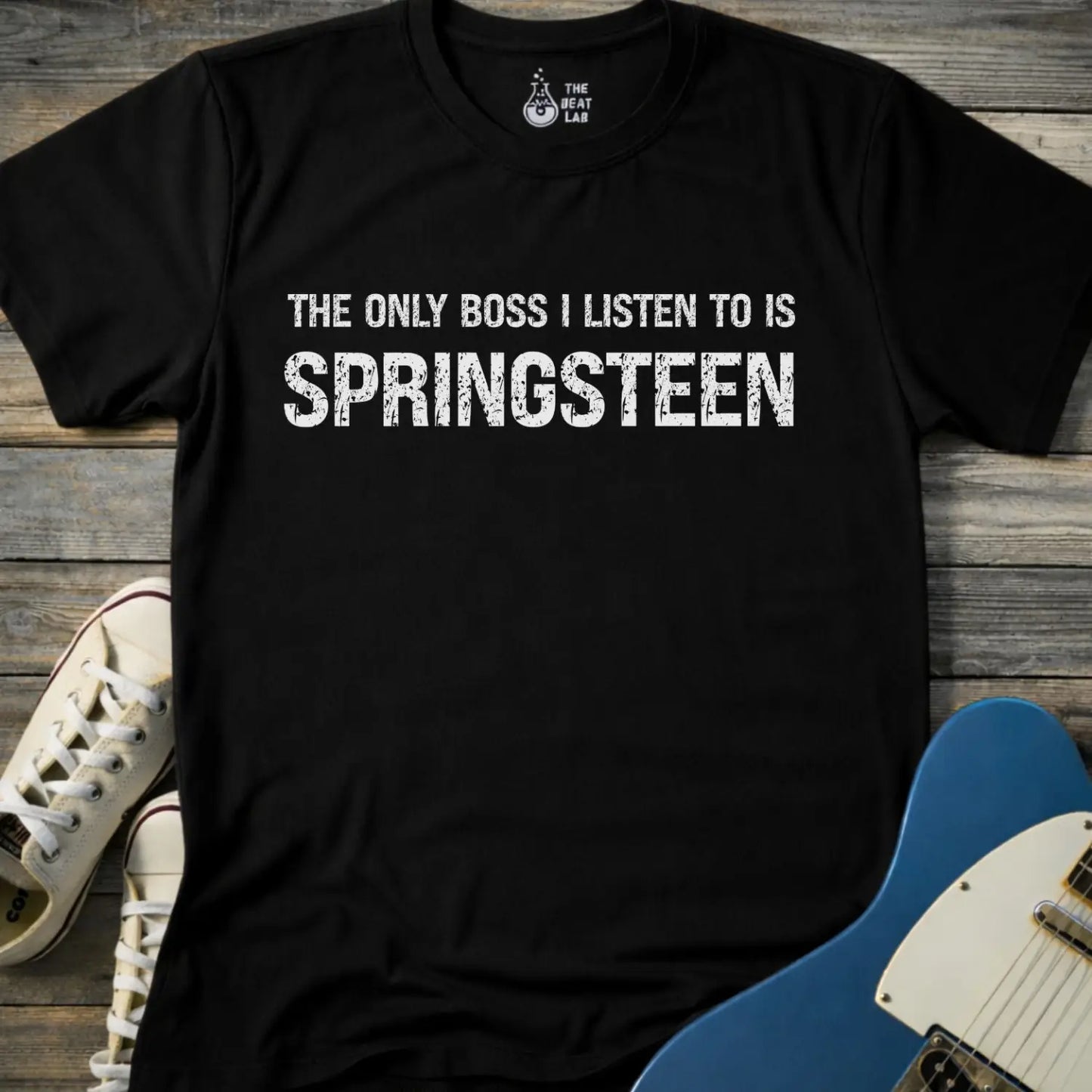 Black color of gildan 64000 t-shirt featuring funny music quote the only boss I listen to is springsteen, bruce springsteen shirt